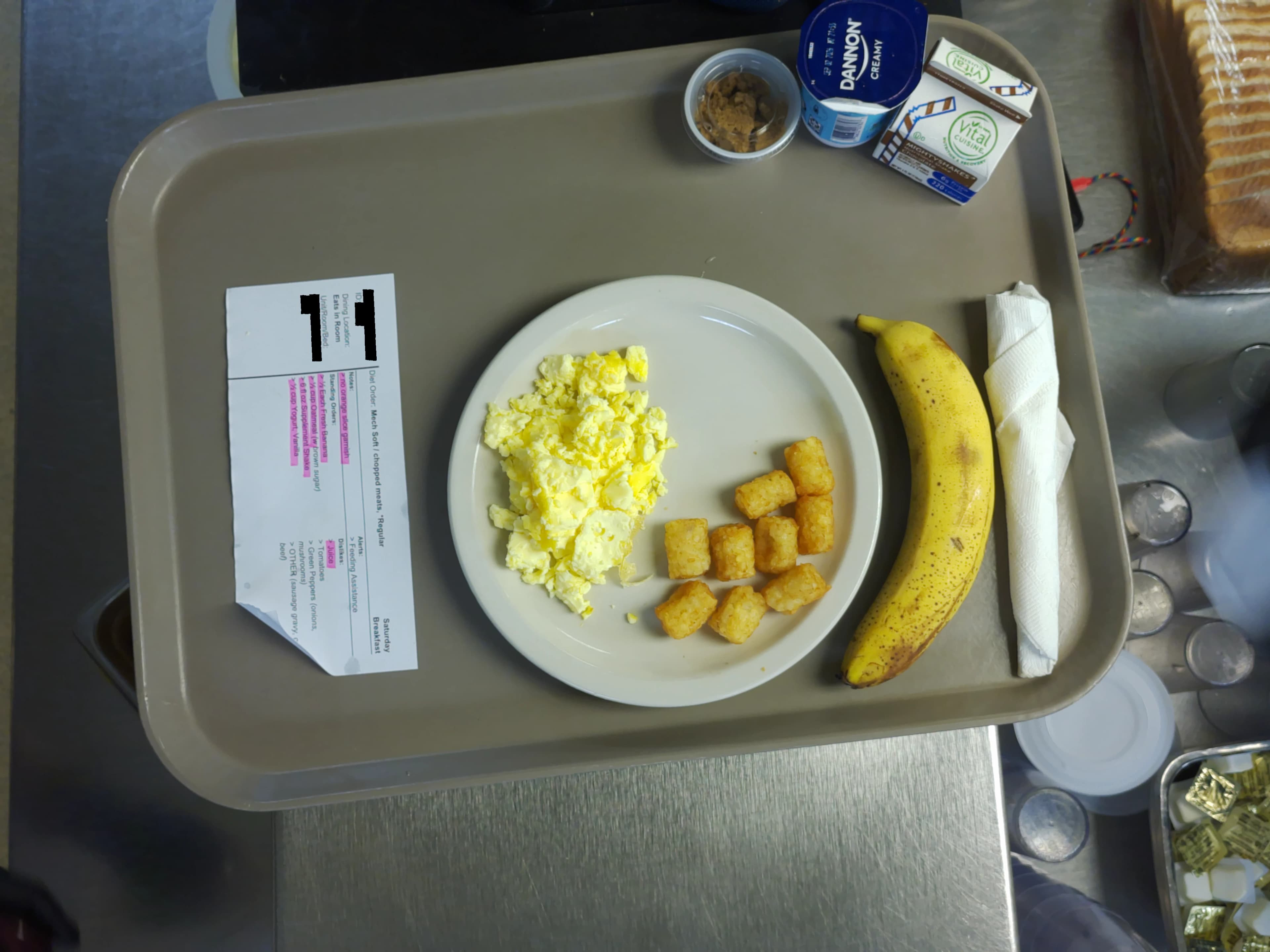 Tray photo: modified-texture ticket, a whole banana, and tater tots.